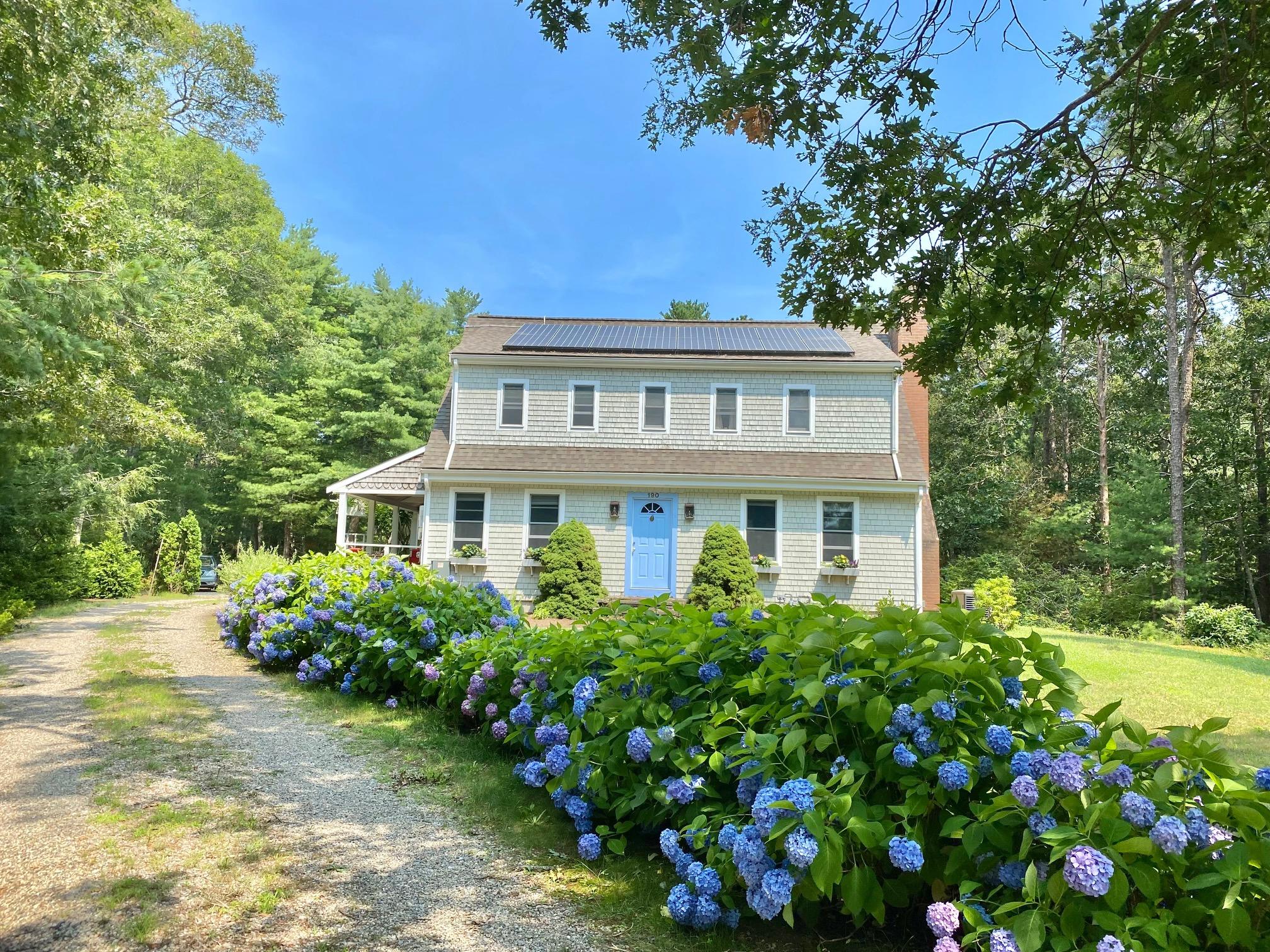 190 Little River Road Cotuit, MA 02635 - Photo 1 of 23 a front view of a house with a yard