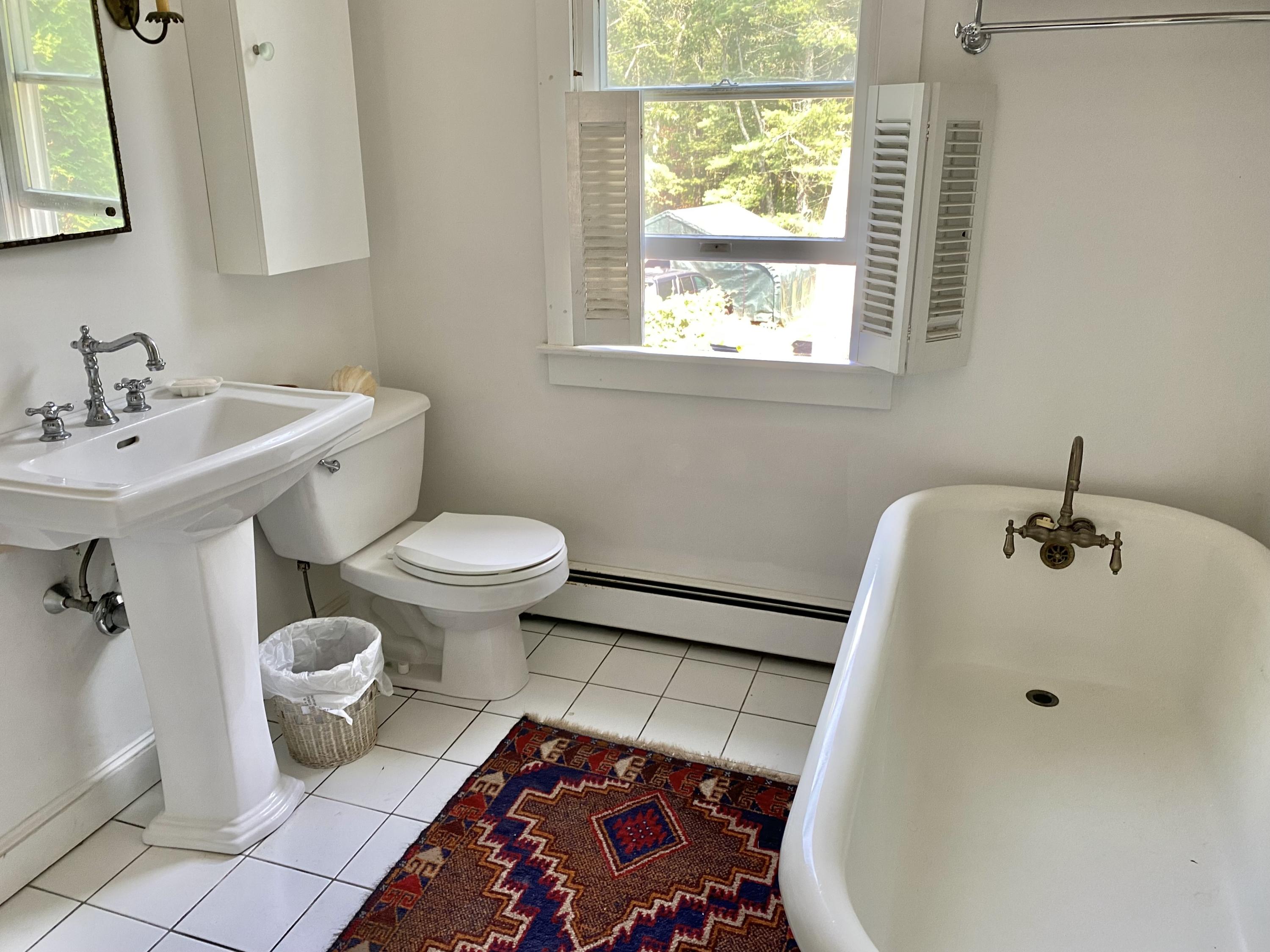 190 Little River Road Cotuit, MA 02635 - Photo 15 of 23 a bathroom with a sink toilet and a mirror