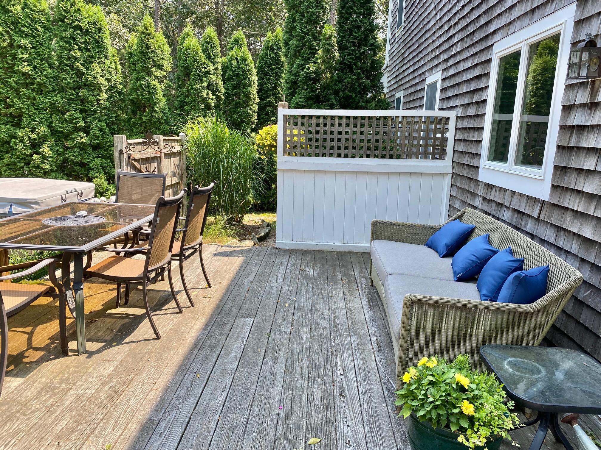 190 Little River Road Cotuit, MA 02635 - Photo 18 of 23 a balcony with furniture and wooden floor