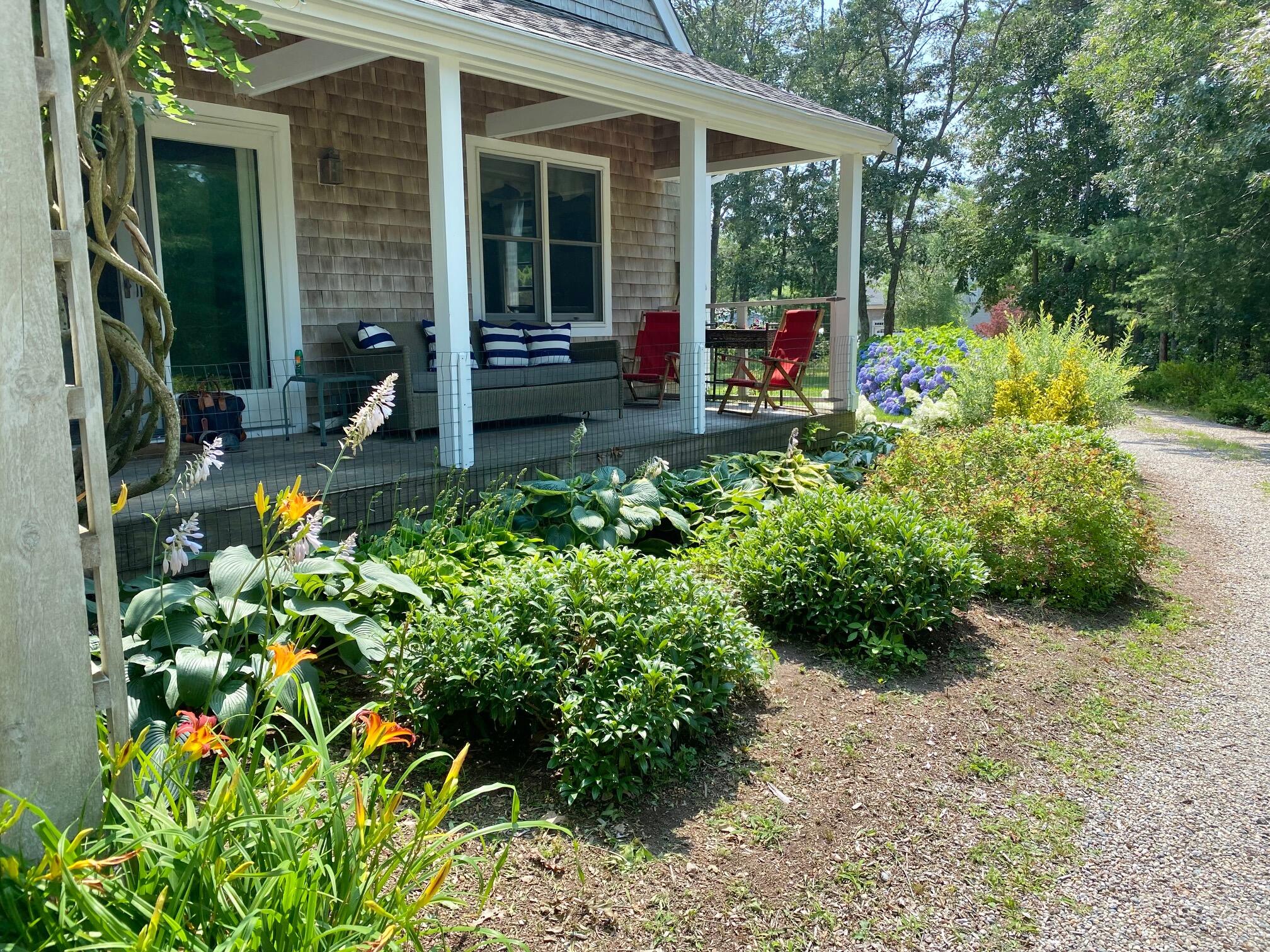 190 Little River Road Cotuit, MA 02635 - Photo 4 of 23 a backyard of a house with lots of green space