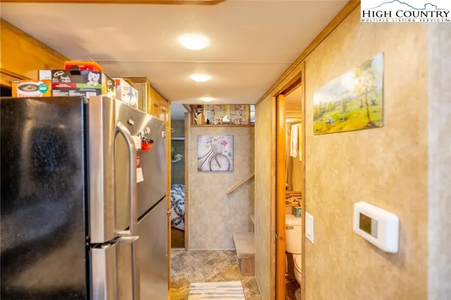 a view of walk in closet with clothes