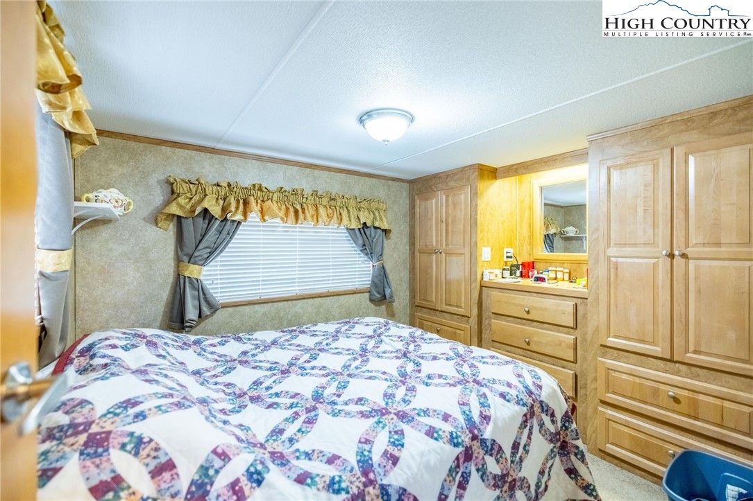 2330 Edmonds Road Galax, VA 24333 - Photo 14 of 42 a bedroom with a bed and a dresser