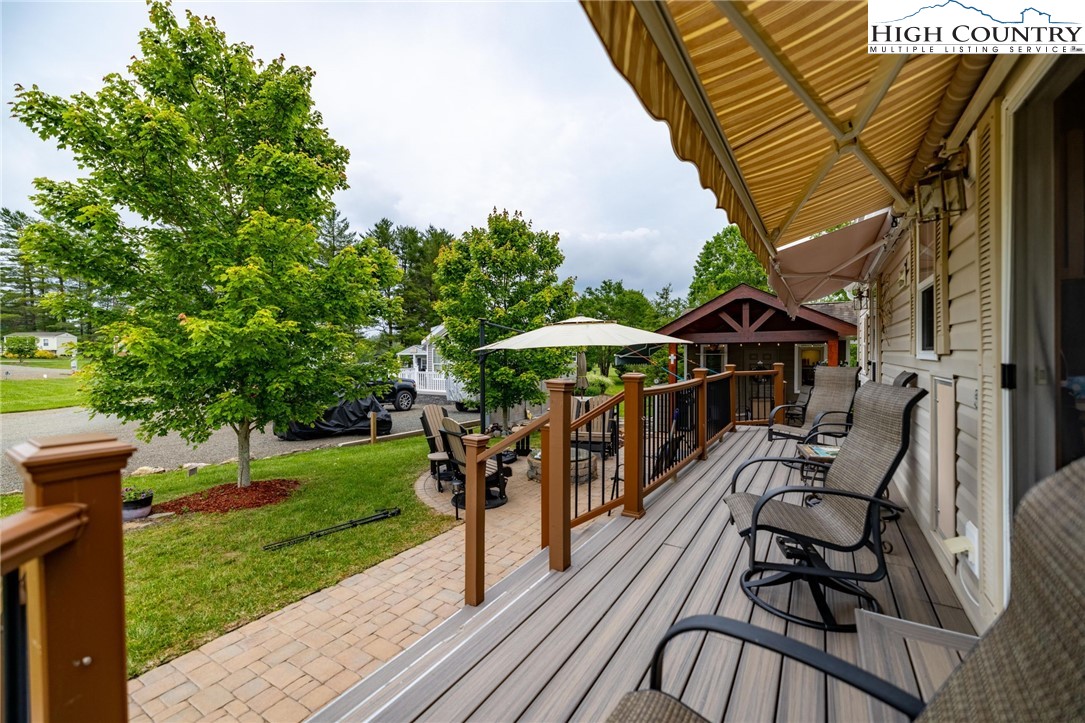 2330 Edmonds Road Galax, VA 24333 - Photo 24 of 42 a view of a patio with a table and chairs under an umbrella with a garden