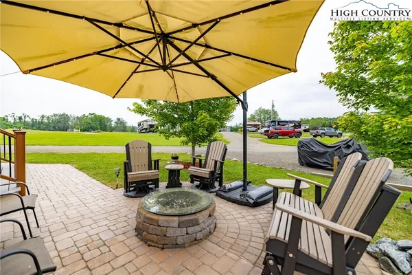 a view of a chairs and table in the patio