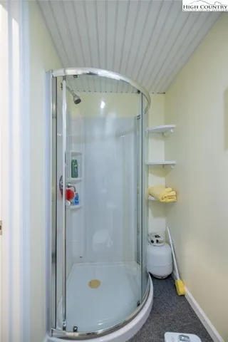 a bathroom with a tub and shower