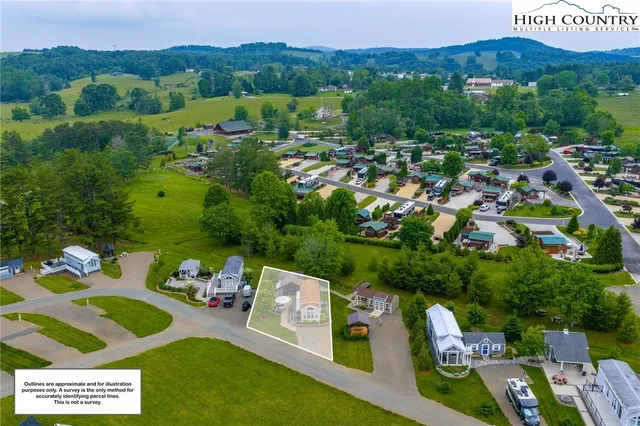 a view of a table and chairs in a garden