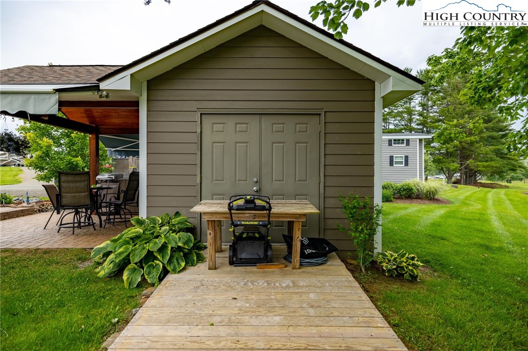 2330 Edmonds Road Galax, VA 24333 - Photo 41 of 42 a view of backyard with table and chairs and potted plants