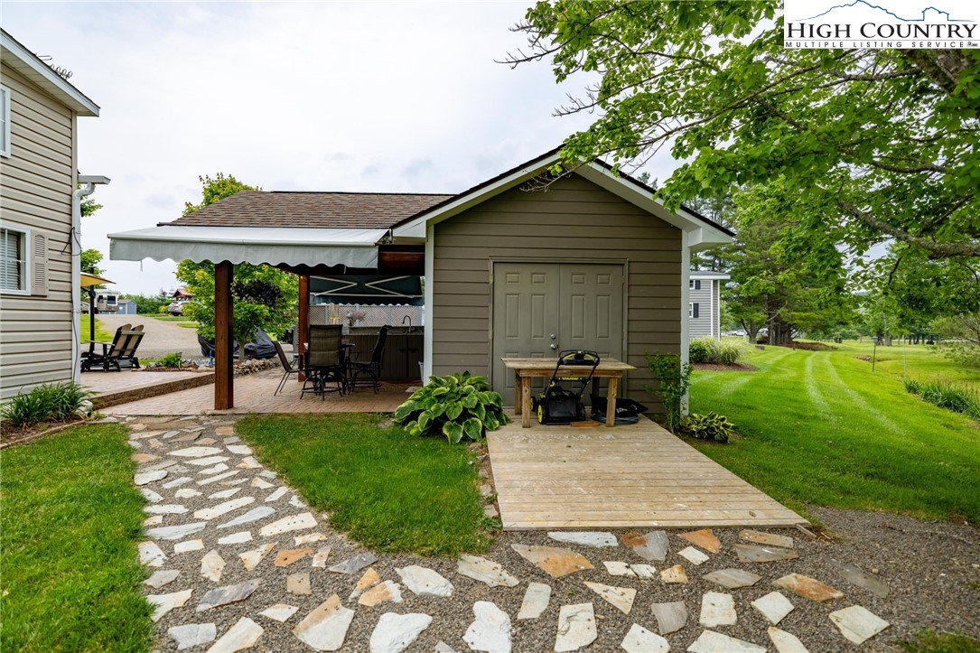 2330 Edmonds Road Galax, VA 24333 - Photo 42 of 42 a view of a chair and table in backyard of the house