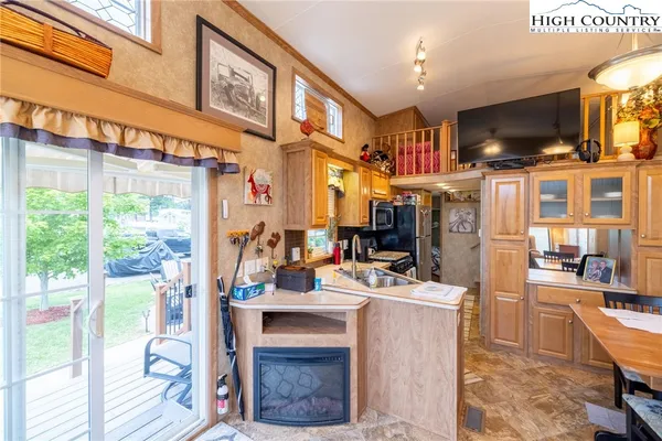 a room with fireplace furniture and a flat screen tv