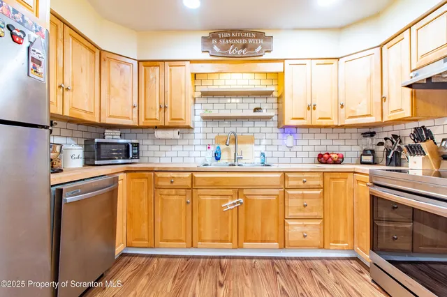 a bedroom with two beds and a chandelier