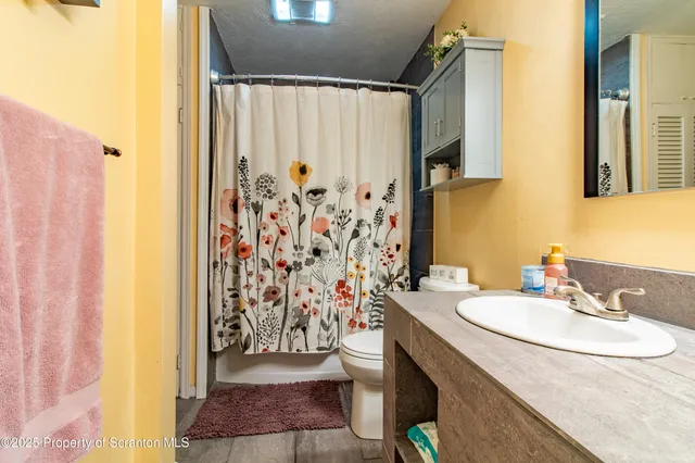 a backyard of a house with outdoor seating