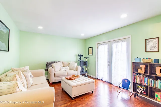 a kitchen with stainless steel appliances granite countertop a refrigerator a sink dishwasher a stove top oven a refrigerator and cabinets