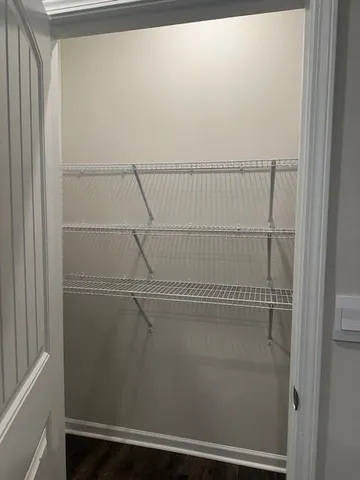 a view of a room with racks on the wall