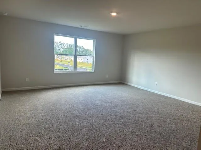 a view of an empty room and closet