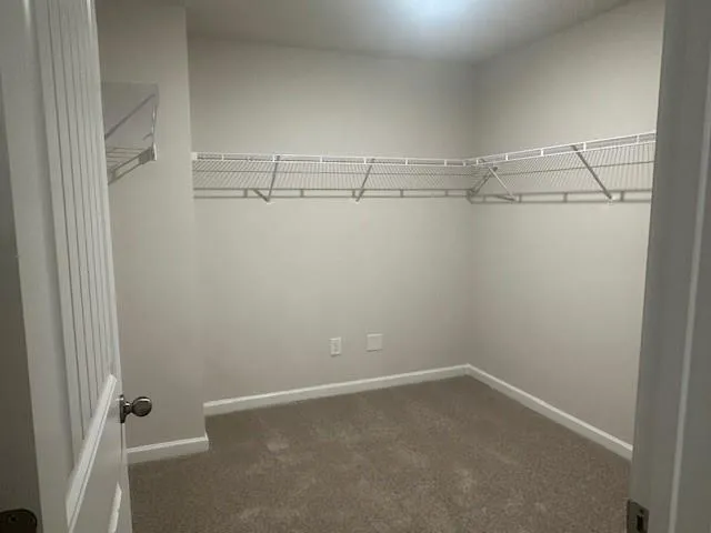 a bathroom with a double vanity sink and mirror