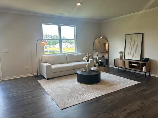a living room with furniture and a window