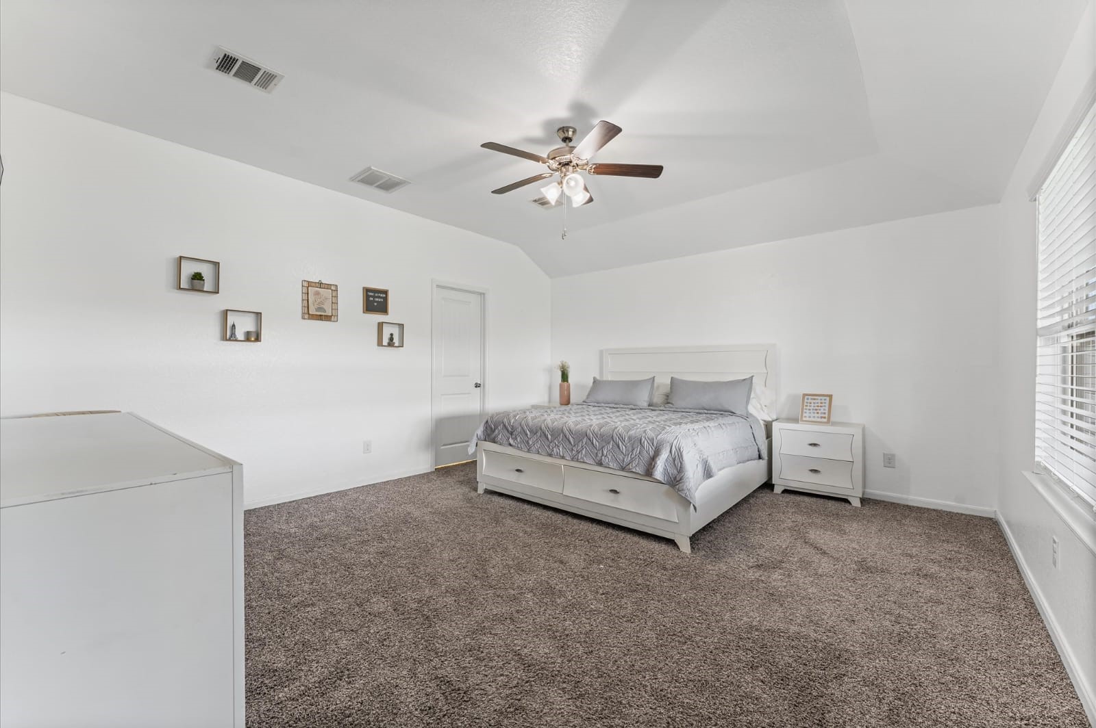 3007 Magellan Ridge Lane Baytown, TX 77521 - Photo 17 of 34 a spacious bedroom with a bed and a window