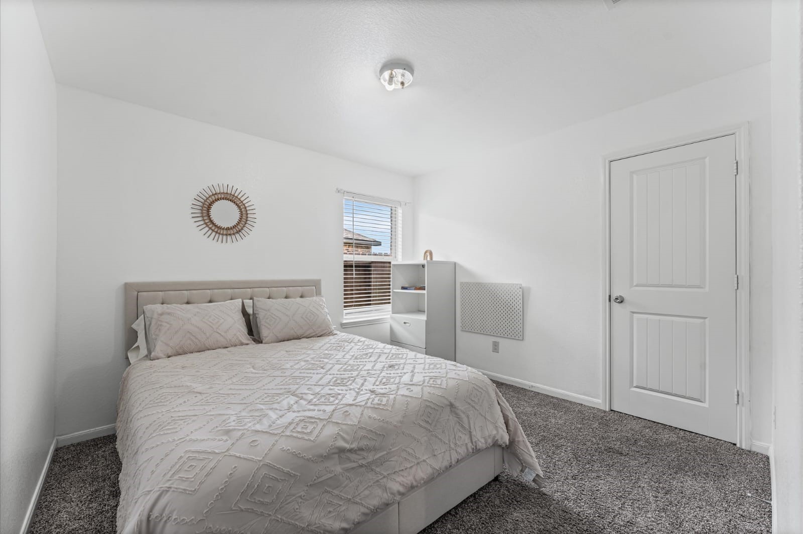 3007 Magellan Ridge Lane Baytown, TX 77521 - Photo 19 of 34 a bedroom with a bed and painting on the wall