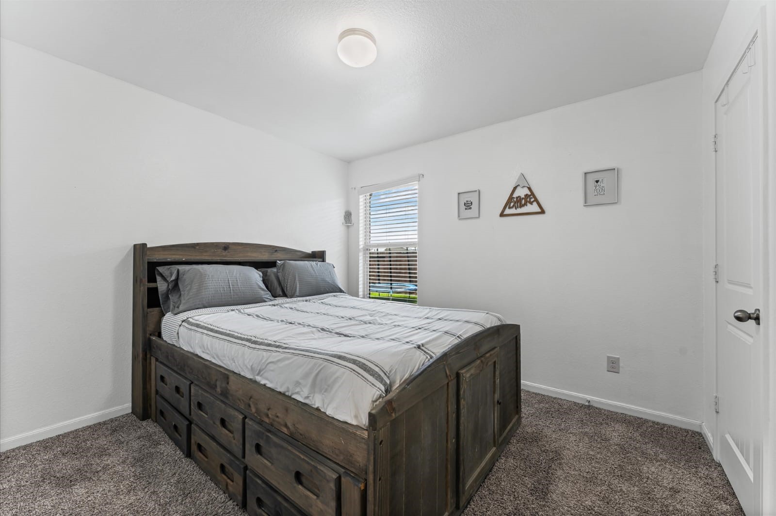 3007 Magellan Ridge Lane Baytown, TX 77521 - Photo 20 of 34 a bedroom with a bed and dresser