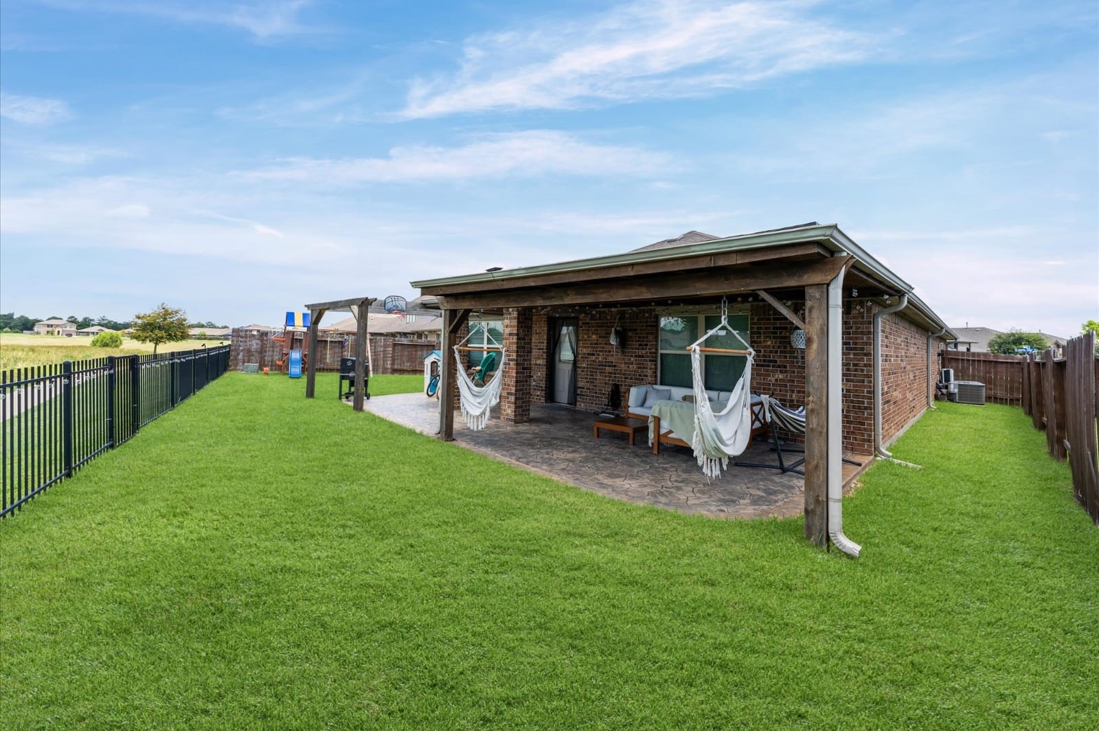 3007 Magellan Ridge Lane Baytown, TX 77521 - Photo 31 of 34 a view of a house with backyard porch and sitting area