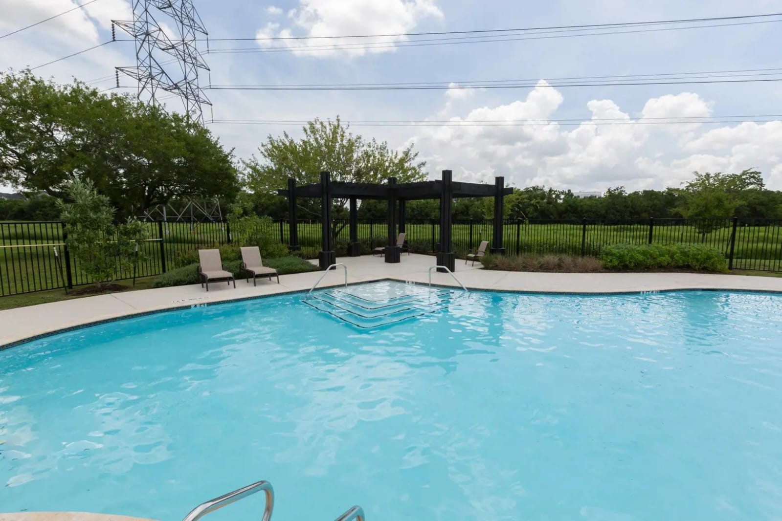 3007 Magellan Ridge Lane Baytown, TX 77521 - Photo 34 of 34 a view of a swimming pool with a yard