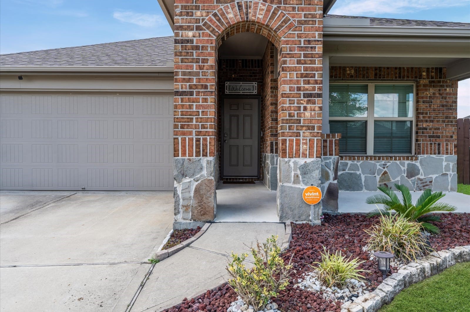 3007 Magellan Ridge Lane Baytown, TX 77521 - Photo 4 of 34 a view of a house with potted plants and a table