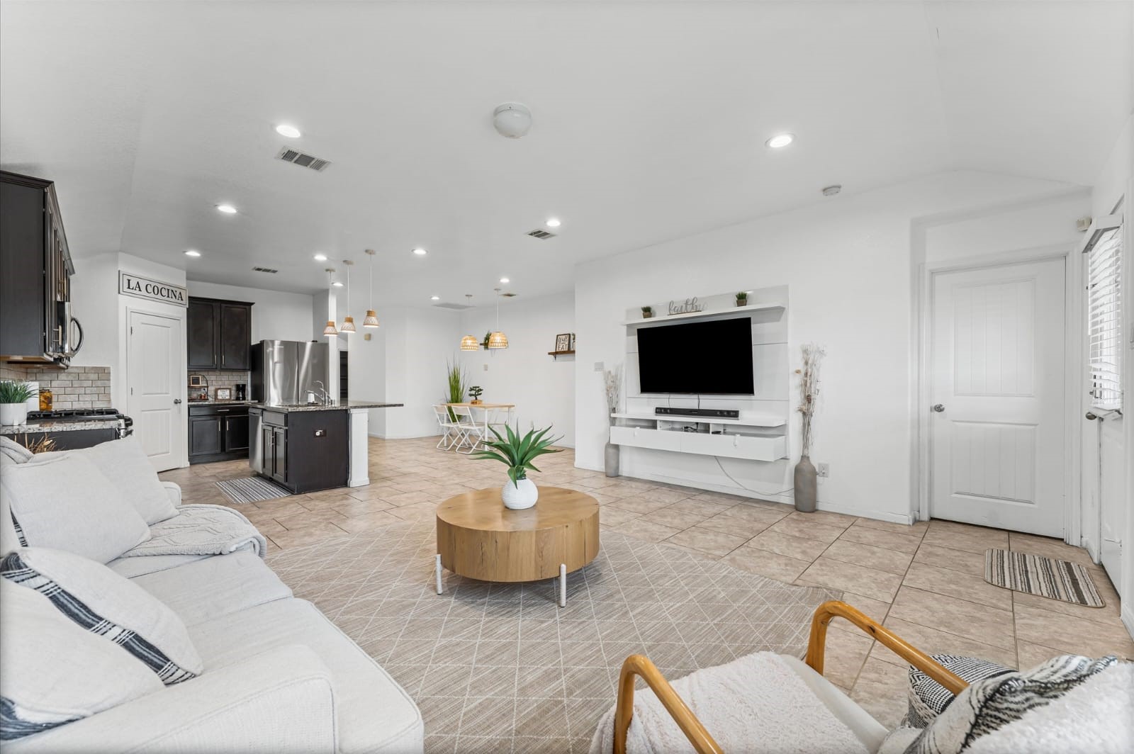 3007 Magellan Ridge Lane Baytown, TX 77521 - Photo 6 of 34 a living room with furniture and a flat screen tv