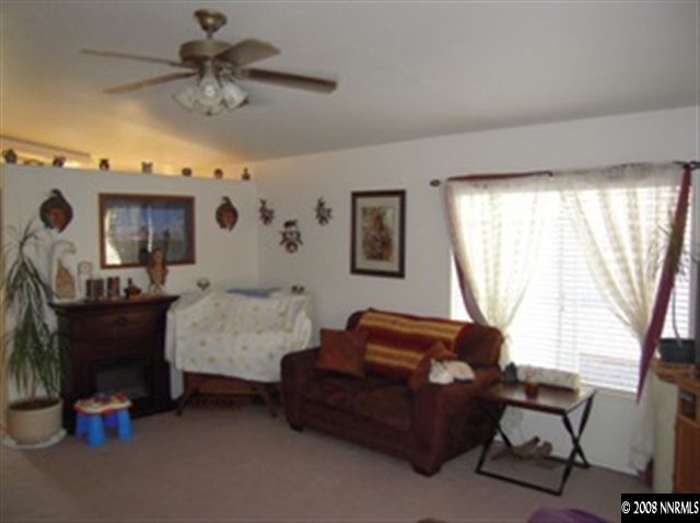 18461 Datewood Court Reno, NV 89508 - Photo 4 of 7 a bedroom with furniture and a window