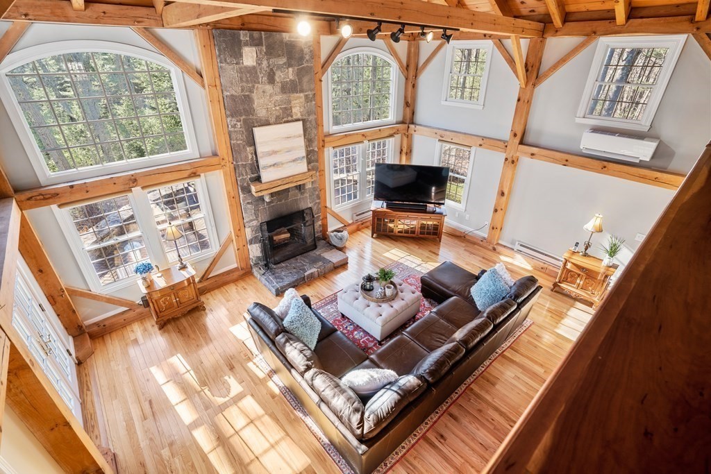47 Wake Robin Road Sudbury, MA 01776 - Photo 10 of 41 a living room with furniture and a floor to ceiling window