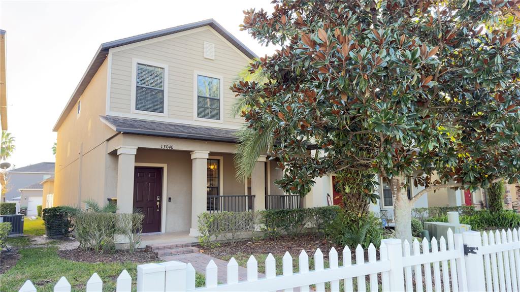 13040 Overstreet Road Windermere, FL 34786 - Photo 1 of 45 a front view of house with yard