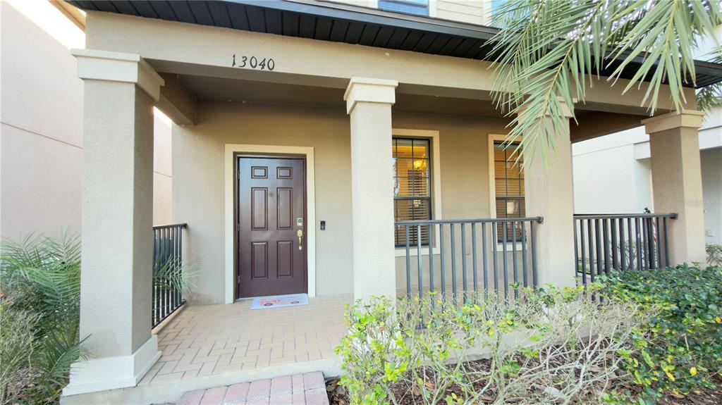 13040 Overstreet Road Windermere, FL 34786 - Photo 2 of 45 a front view of a house with a yard