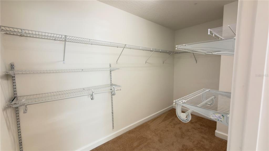 13040 Overstreet Road Windermere, FL 34786 - Photo 29 of 45 a view of a room with racks on the wall
