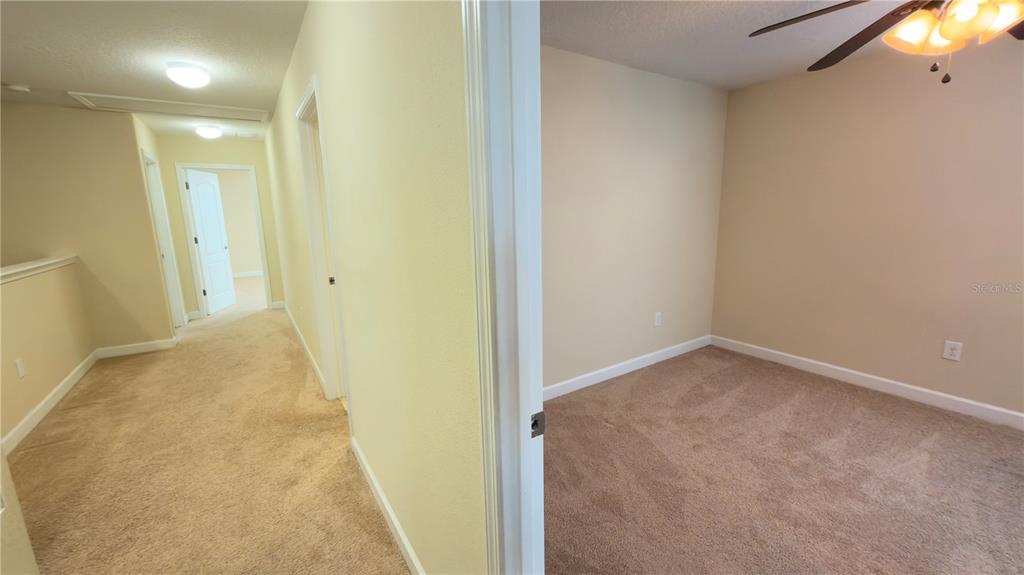 13040 Overstreet Road Windermere, FL 34786 - Photo 33 of 45 a view of a room with a wardrobe space