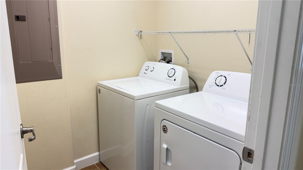 13040 Overstreet Road Windermere, FL 34786 - Photo 37 of 45 a utility room with dryer and washer