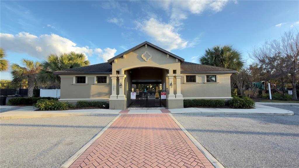 13040 Overstreet Road Windermere, FL 34786 - Photo 41 of 45 a front view of a house with a yard and garage