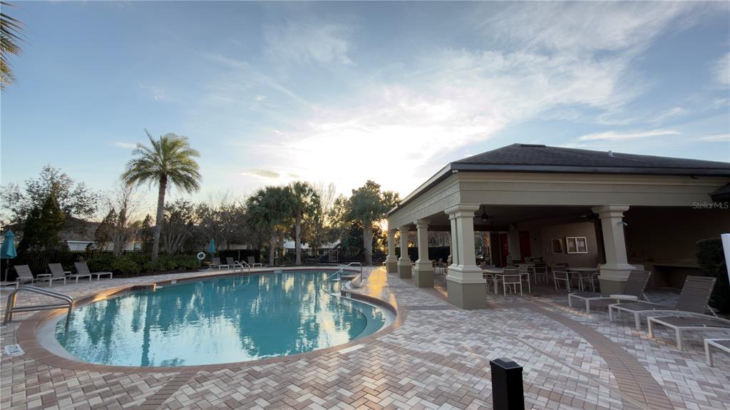 13040 Overstreet Road Windermere, FL 34786 - Photo 42 of 45 a view of a swimming pool with a patio