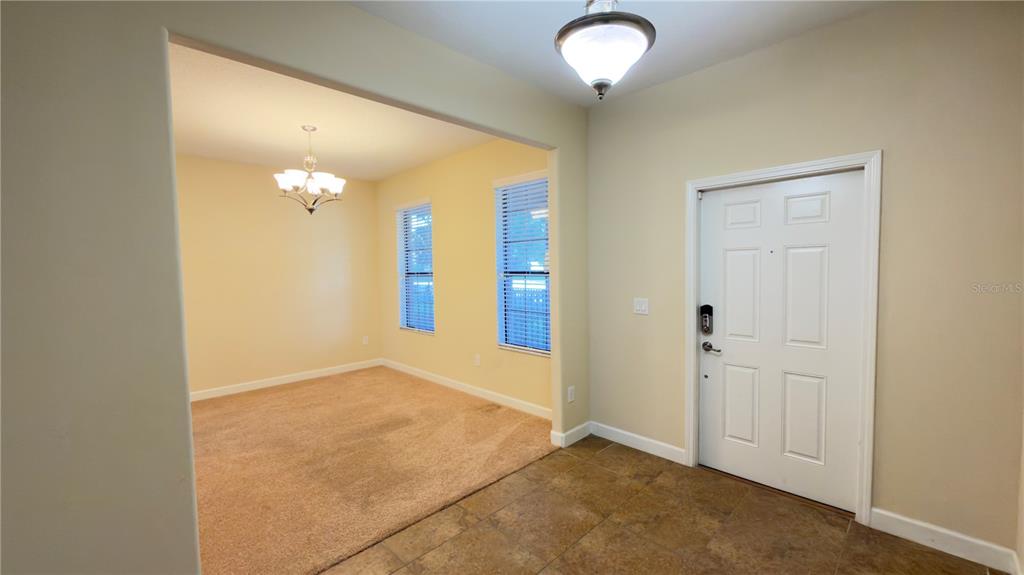 13040 Overstreet Road Windermere, FL 34786 - Photo 6 of 45 an empty room with mirror view