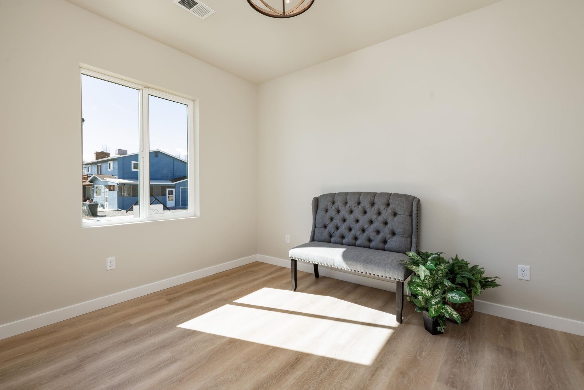 2956 Apollo Drive Grand Junction, CO 81504 - Photo 12 of 33 a white bench sitting in a room next to a window