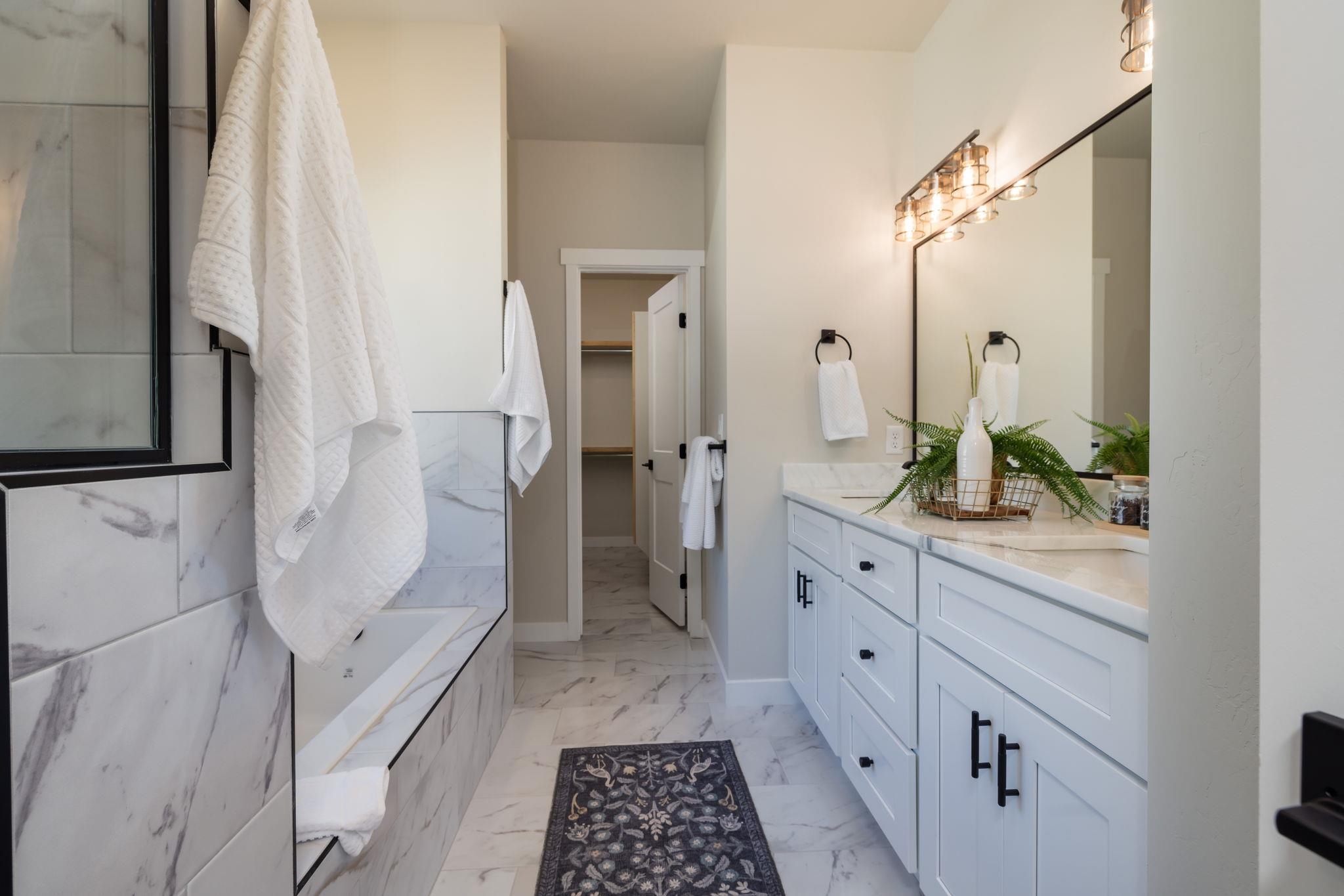 2956 Apollo Drive Grand Junction, CO 81504 - Photo 15 of 33 a bathroom with a granite countertop sink a toilet and shower