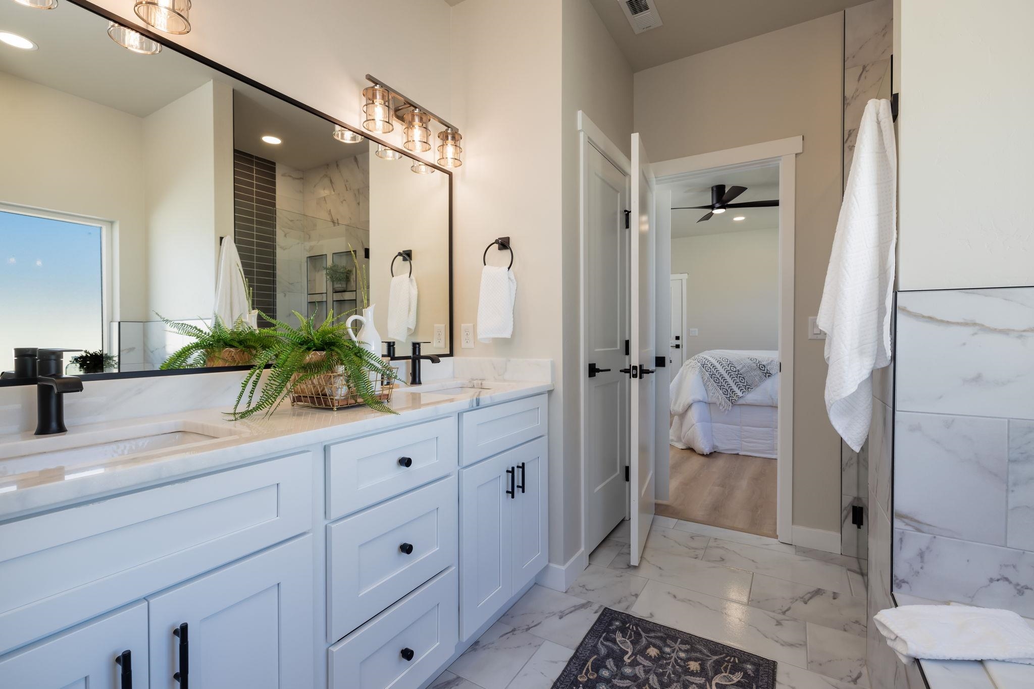 2956 Apollo Drive Grand Junction, CO 81504 - Photo 17 of 33 a bathroom with a shower sink and toilet