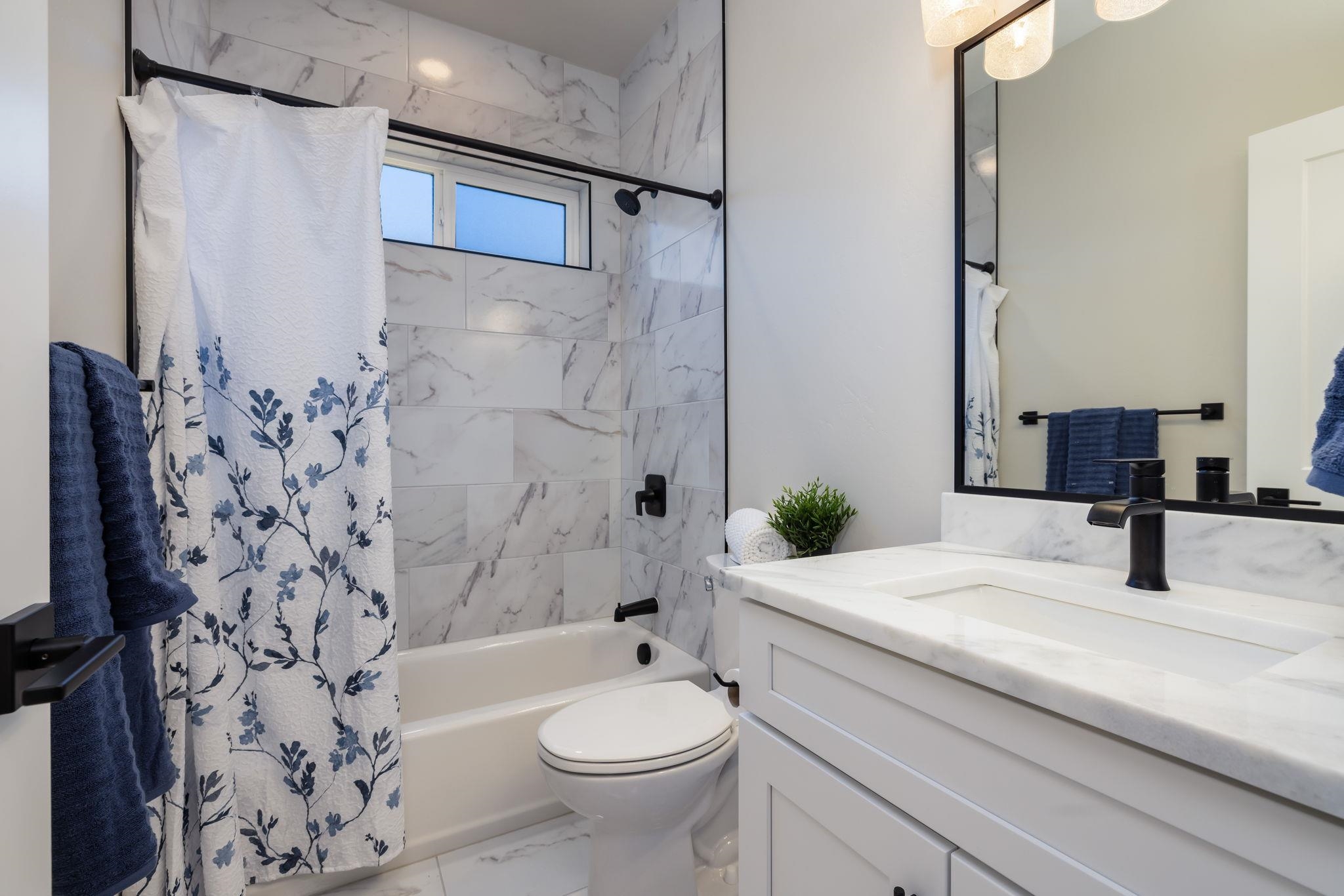 2956 Apollo Drive Grand Junction, CO 81504 - Photo 18 of 33 a bathroom with a sink a toilet and shower