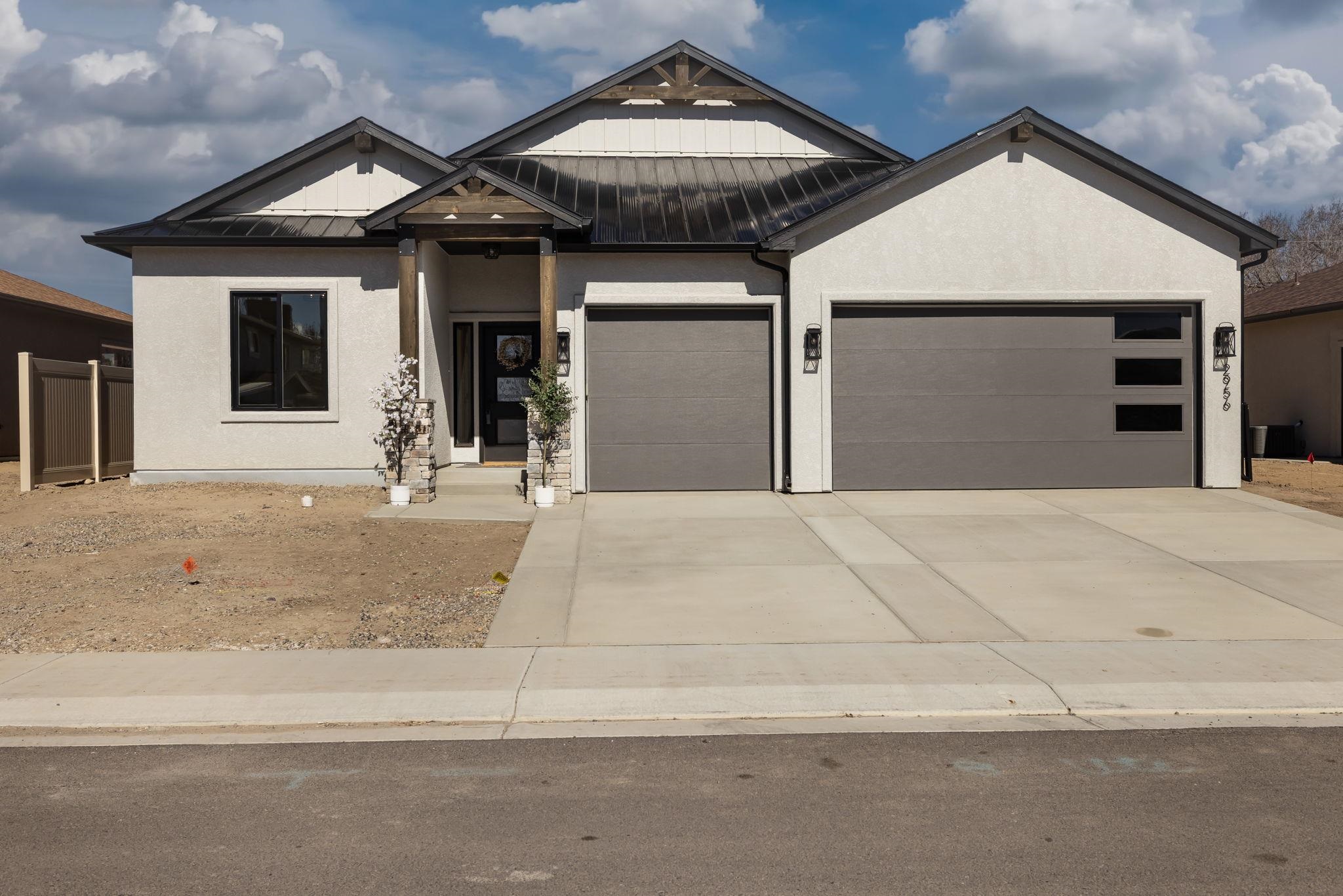 2956 Apollo Drive Grand Junction, CO 81504 - Photo 2 of 33 a front view of a house with garage