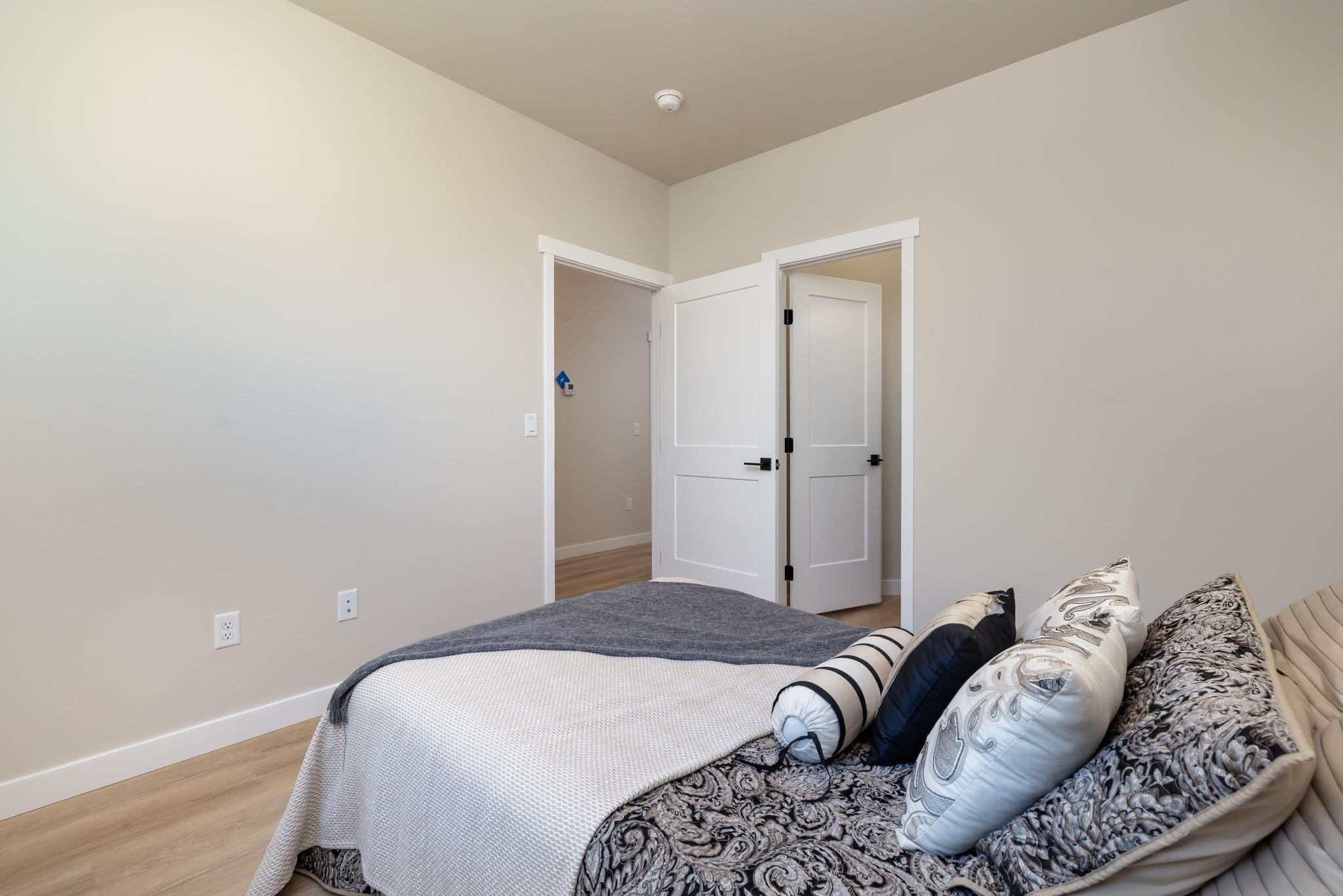 2956 Apollo Drive Grand Junction, CO 81504 - Photo 25 of 33 a bedroom with a bed and a couch