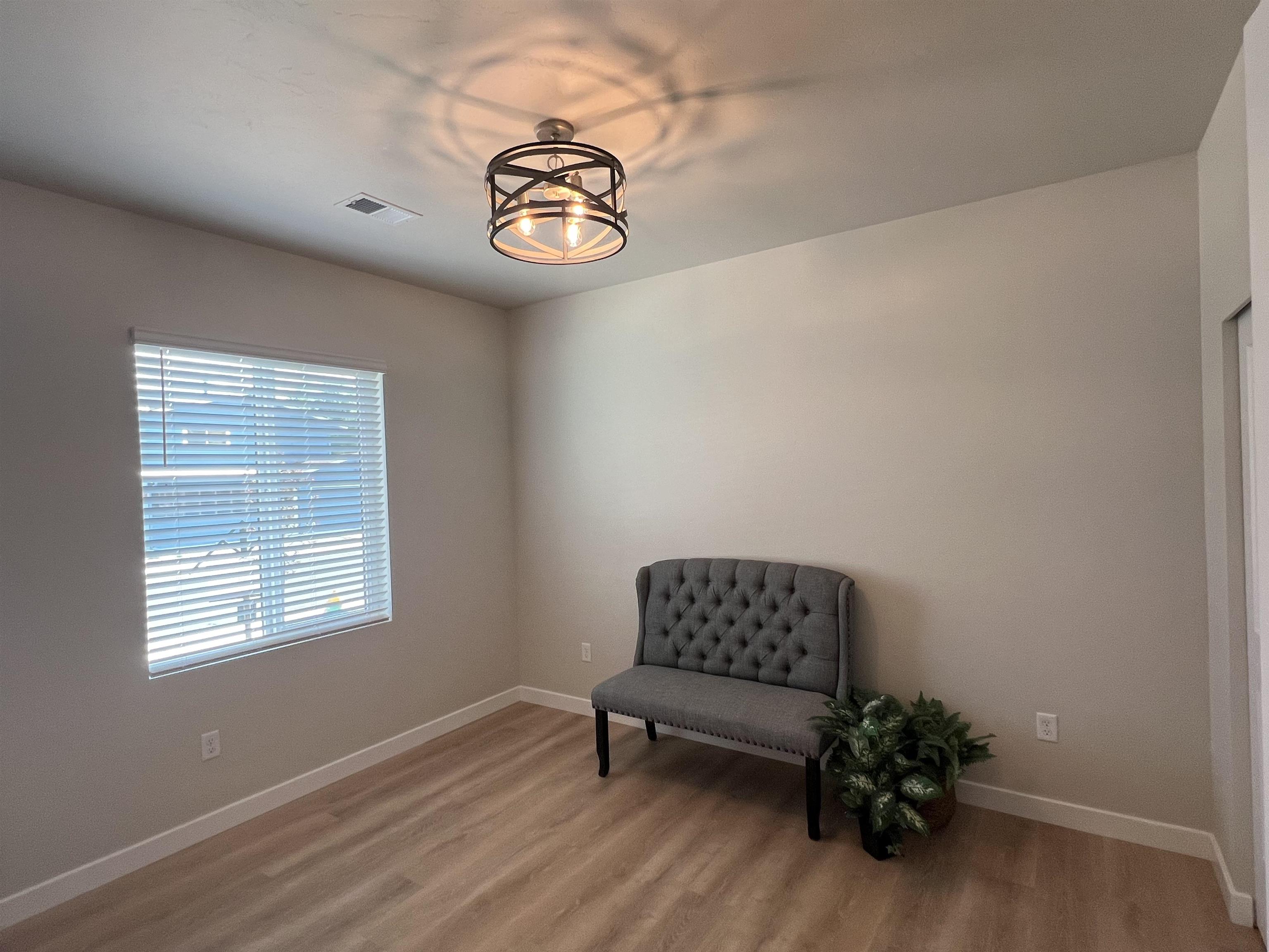 2956 Apollo Drive Grand Junction, CO 81504 - Photo 28 of 33 a view of wooden floor and chair in a room