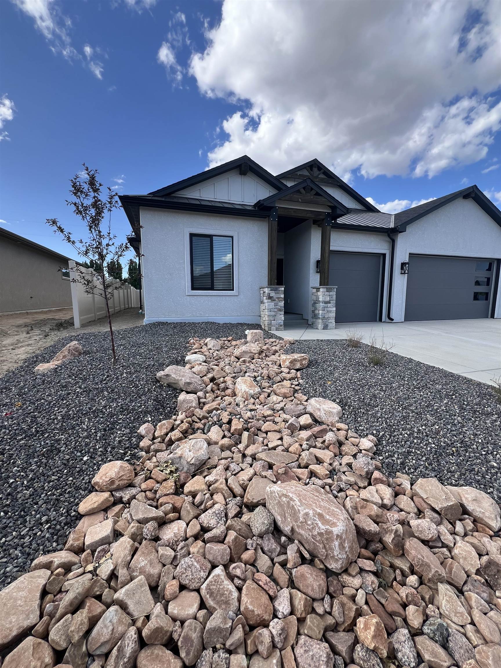2956 Apollo Drive Grand Junction, CO 81504 - Photo 30 of 33 a front view of a house with a yard
