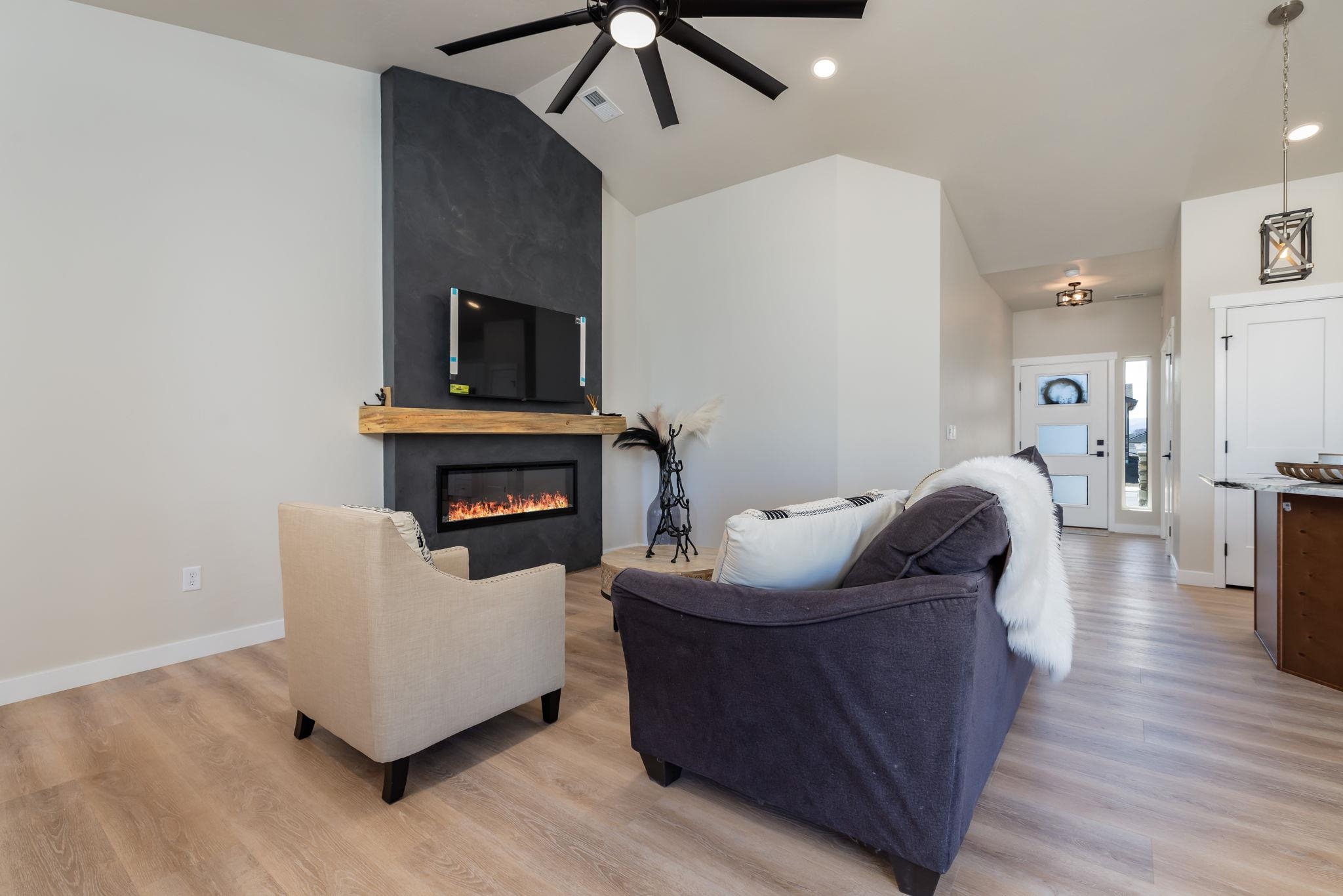 2956 Apollo Drive Grand Junction, CO 81504 - Photo 5 of 33 a living room with furniture and a fireplace