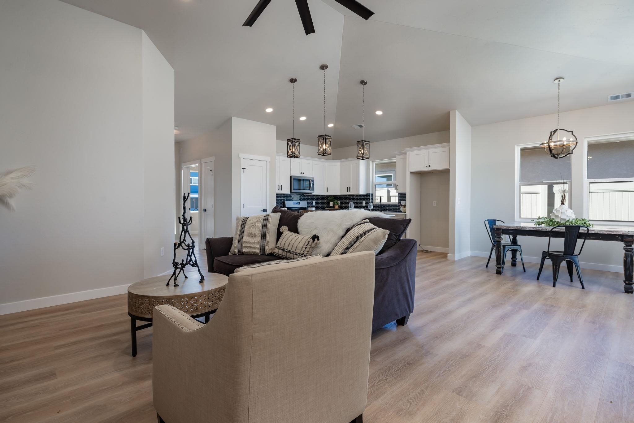 2956 Apollo Drive Grand Junction, CO 81504 - Photo 6 of 33 a living room with furniture and a chandelier