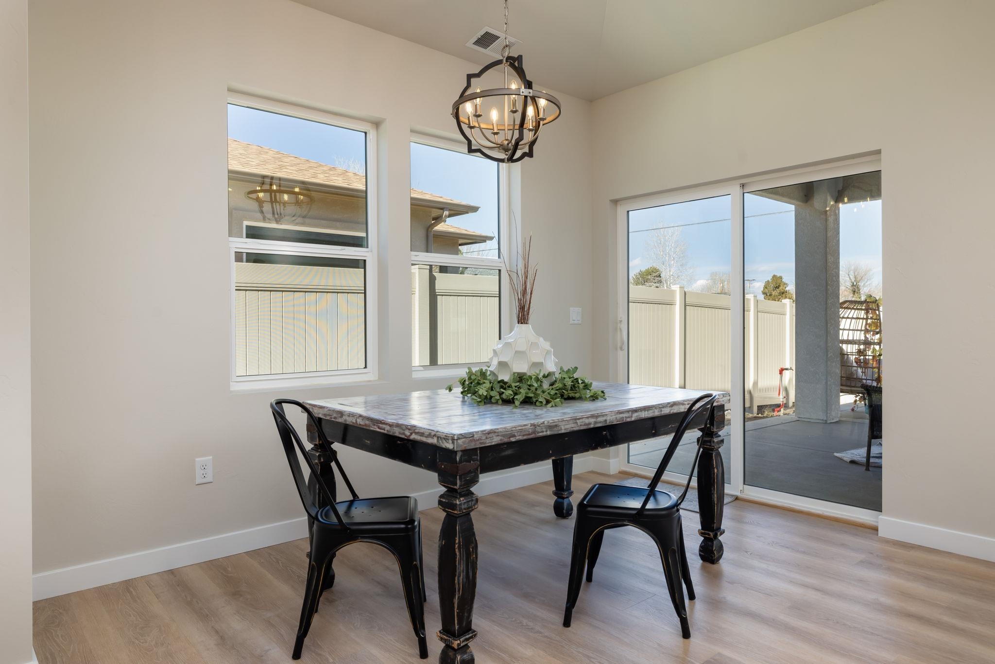 2956 Apollo Drive Grand Junction, CO 81504 - Photo 7 of 33 a view of a dining room with furniture window and wooden floor