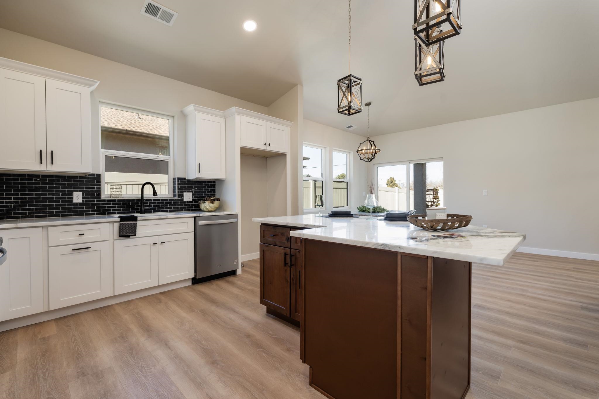 2956 Apollo Drive Grand Junction, CO 81504 - Photo 8 of 33 a kitchen with a sink cabinets and window