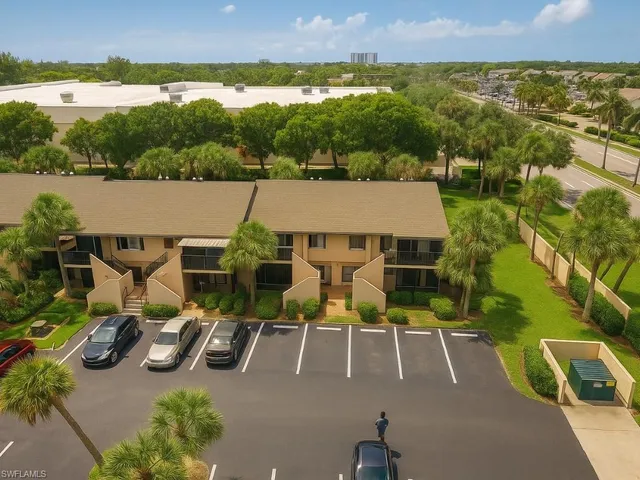 an aerial view of a house with lake view